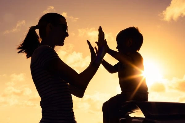 Image of happy mother and child after resolving child arrangements Woking
